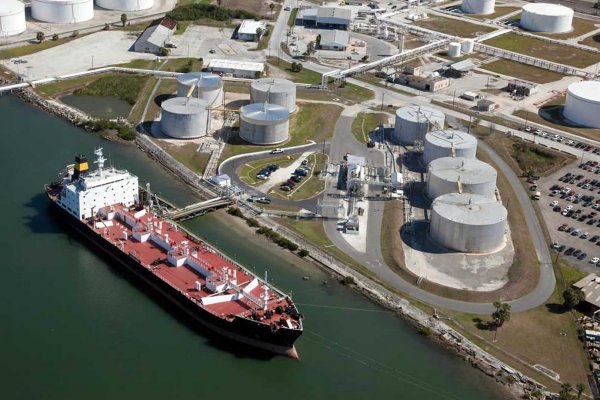 Tanker loading oil at a tank terminal